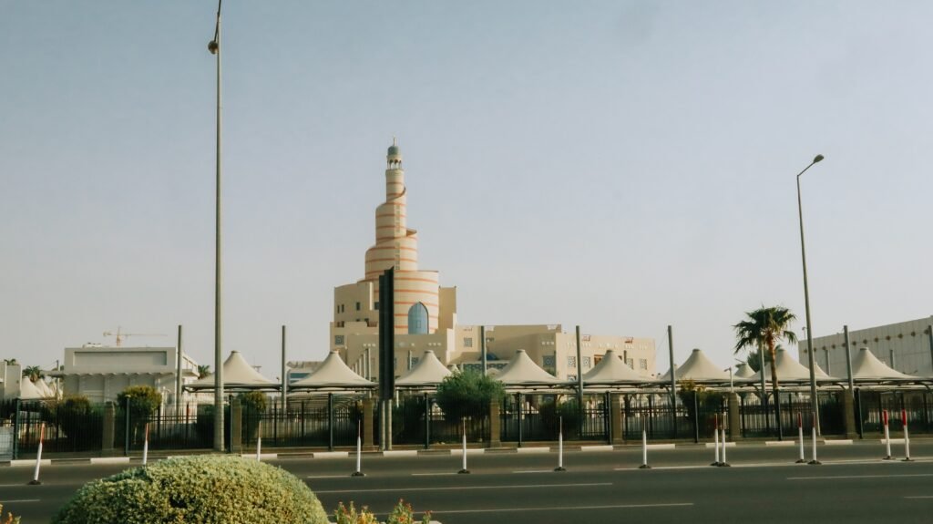 The iconic Fanar Mosque in Doha, Qatar, stands majestically under a clear blue sky.